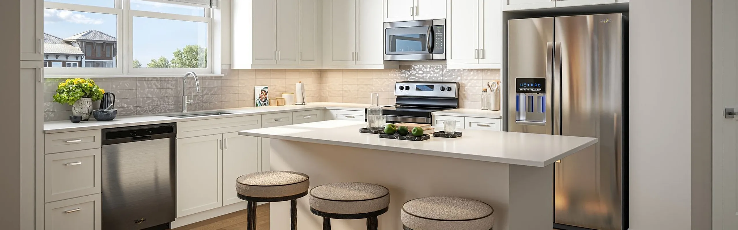 Elegant kitchen with modern white cabinetry, stainless steel appliances, and a spacious island with bar seating.