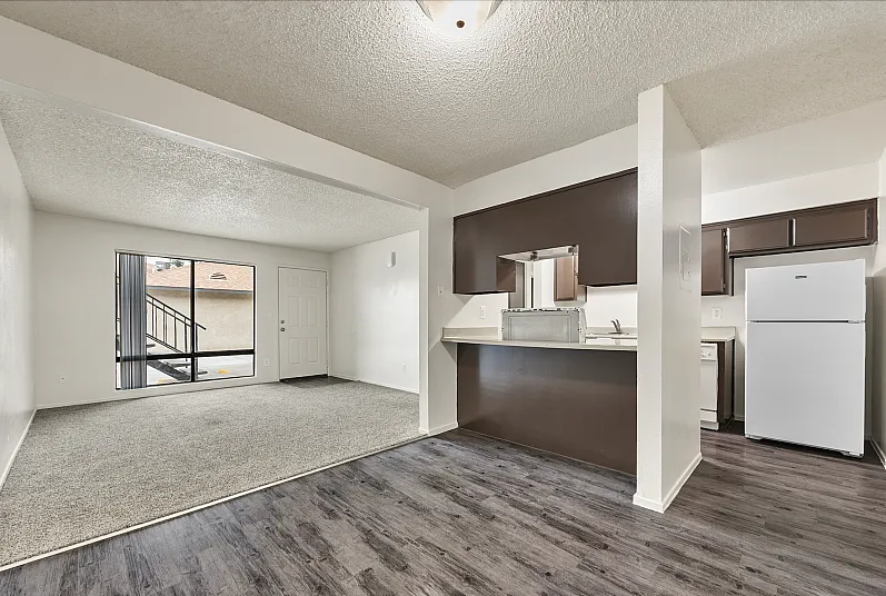 Spacious apartment living room with bay window, for natural light.