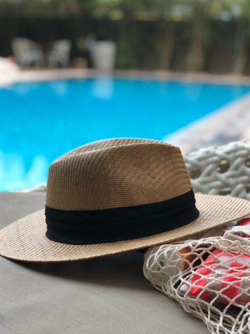 hat by the pool