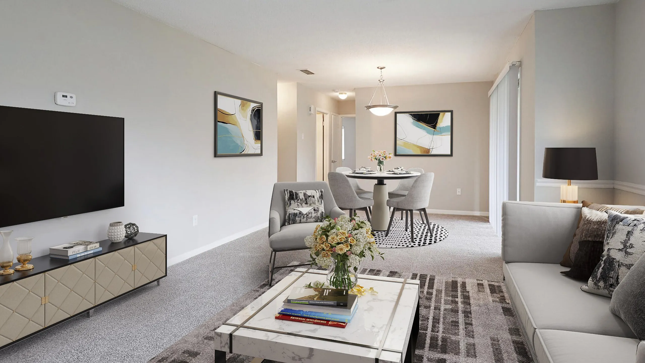 Elegant open-plan living and dining area with modern decor, plush seating, and abstract artwork, offering a bright and inviting atmosphere.