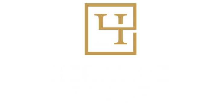 Heritage Place logo featuring a modern, stylized 'H' design in gold and white.