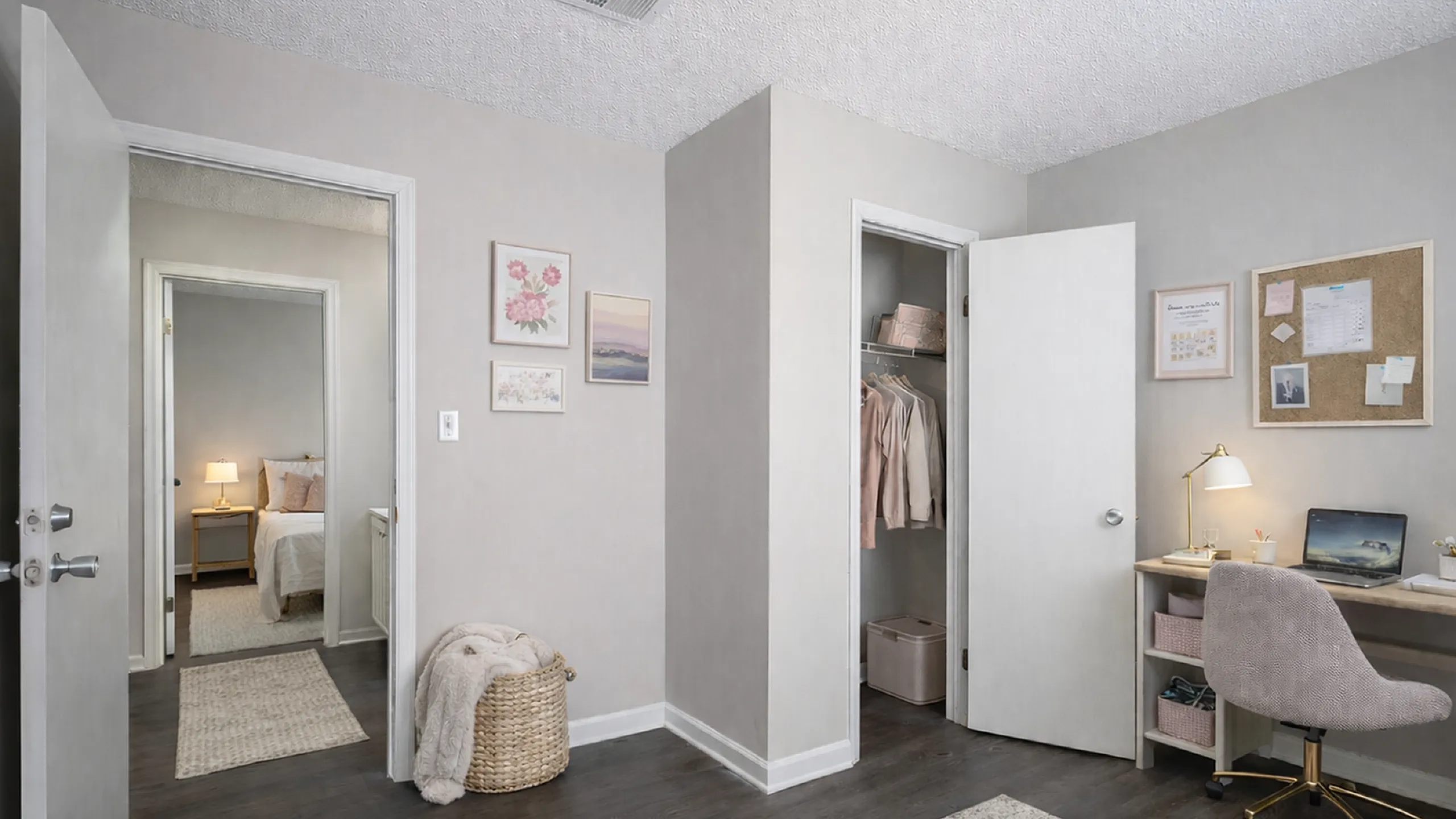 Charming bedroom with cozy workspace, featuring stylish decor, a serene bed area, and ample closet space on a tranquil hardwood floor.