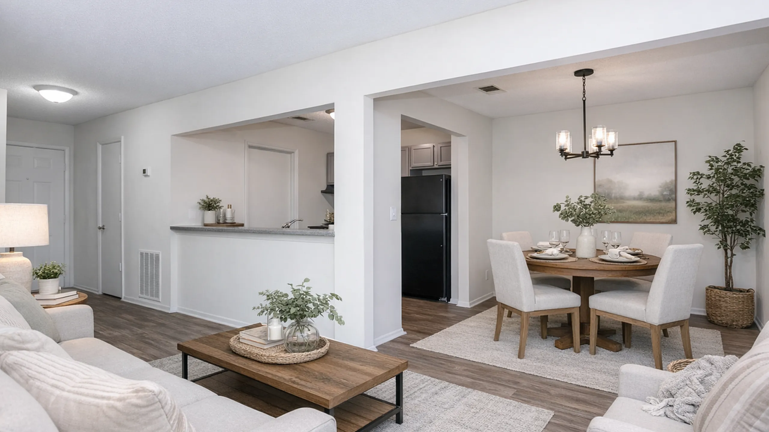 Charming open-concept living and dining area with cozy seating, modern decor, and inviting natural light.