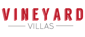 Elegant Vineyard Villas brand logo in bold red and sleek black font.