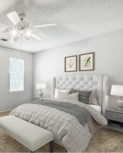 Inviting bedroom with plush carpet, elegant tufted headboard, and cozy lighting, leading to a spacious walk-in closet.