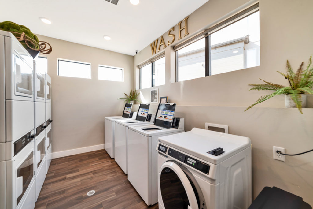 Laundry room with 4 washing machines and 6 dryers