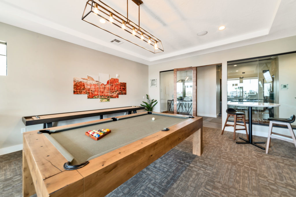 Game room with billiards table, flat screen TV, fireplace, 2 man table, and shuffleboard game table