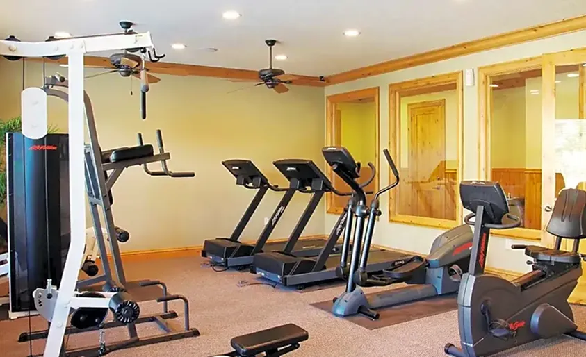 Fitness center with 2 treadmills, 1 elliptical, 1 stationary bike, 1 lateral pull-down machine, 1 multi-purpose upper-body and abdominal station and leg machine