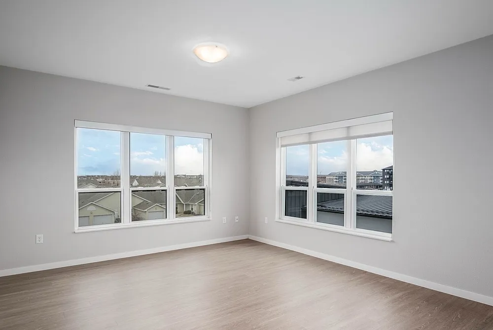 Bright and airy corner room with large windows providing stunning views and natural light.