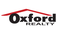 Oxford Realty logo featuring bold black text with a red roof design element, conveying professionalism and trust.