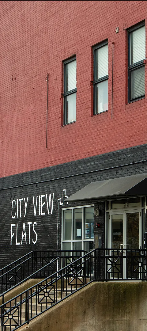 Chic urban exterior of City View Flats showcasing a modern brick design and welcoming entrance at 206.