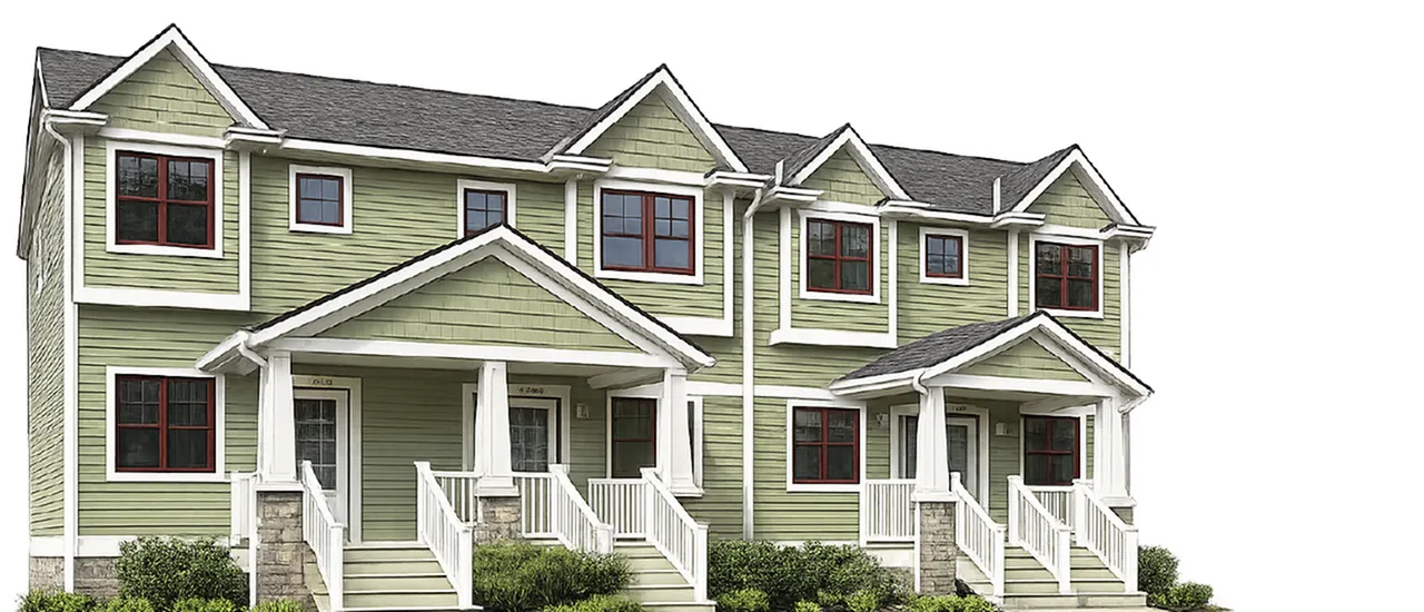Charming green townhouse with classic architecture and inviting front porches, perfect for comfortable living.