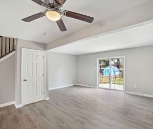 6302 Jacobs Court, Eldersburg, Living area with ceiling fan, storage closet, and sliding paned door to private patio & backyard