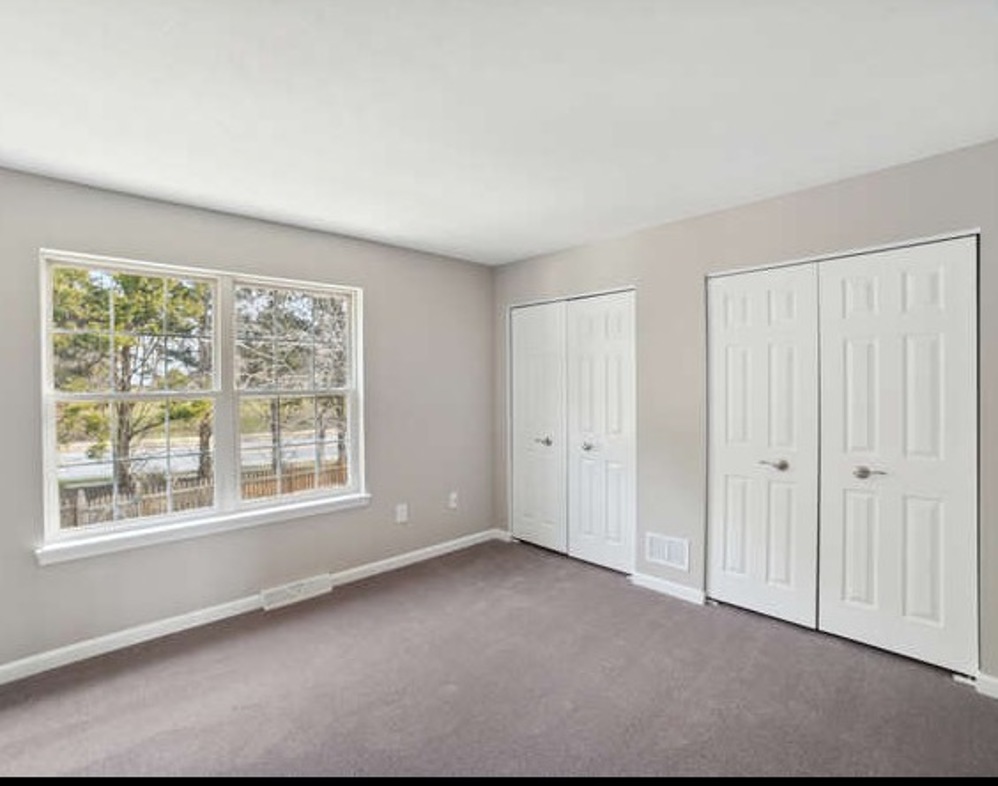 Bedroom with two closets and large windows at Jacobs Court in Eldersburg, MD