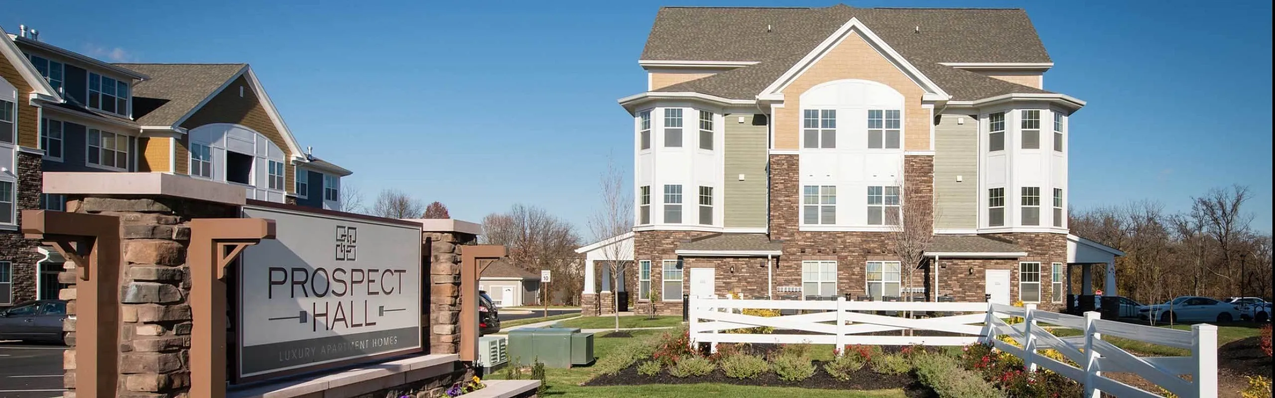 Inviting Prospect Hall luxury apartments with manicured gardens, elegant architecture, and a welcoming community ambiance.