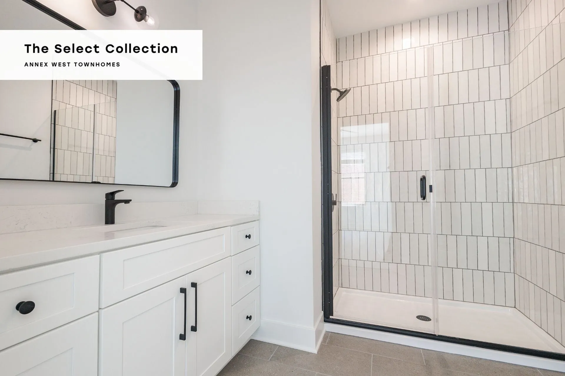 Elegant bathroom design in The Select Collection at Annex West Townhomes featuring modern fixtures, spacious shower, and sleek cabinetry.