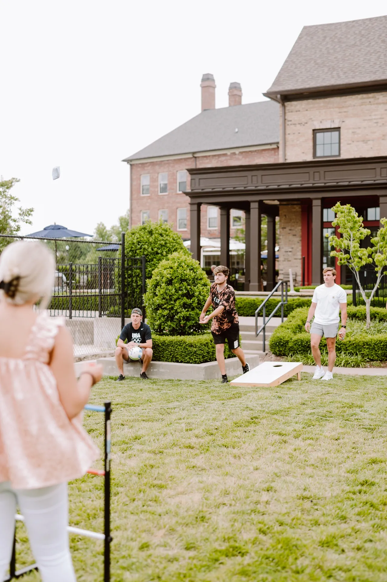 People playing cornhole
