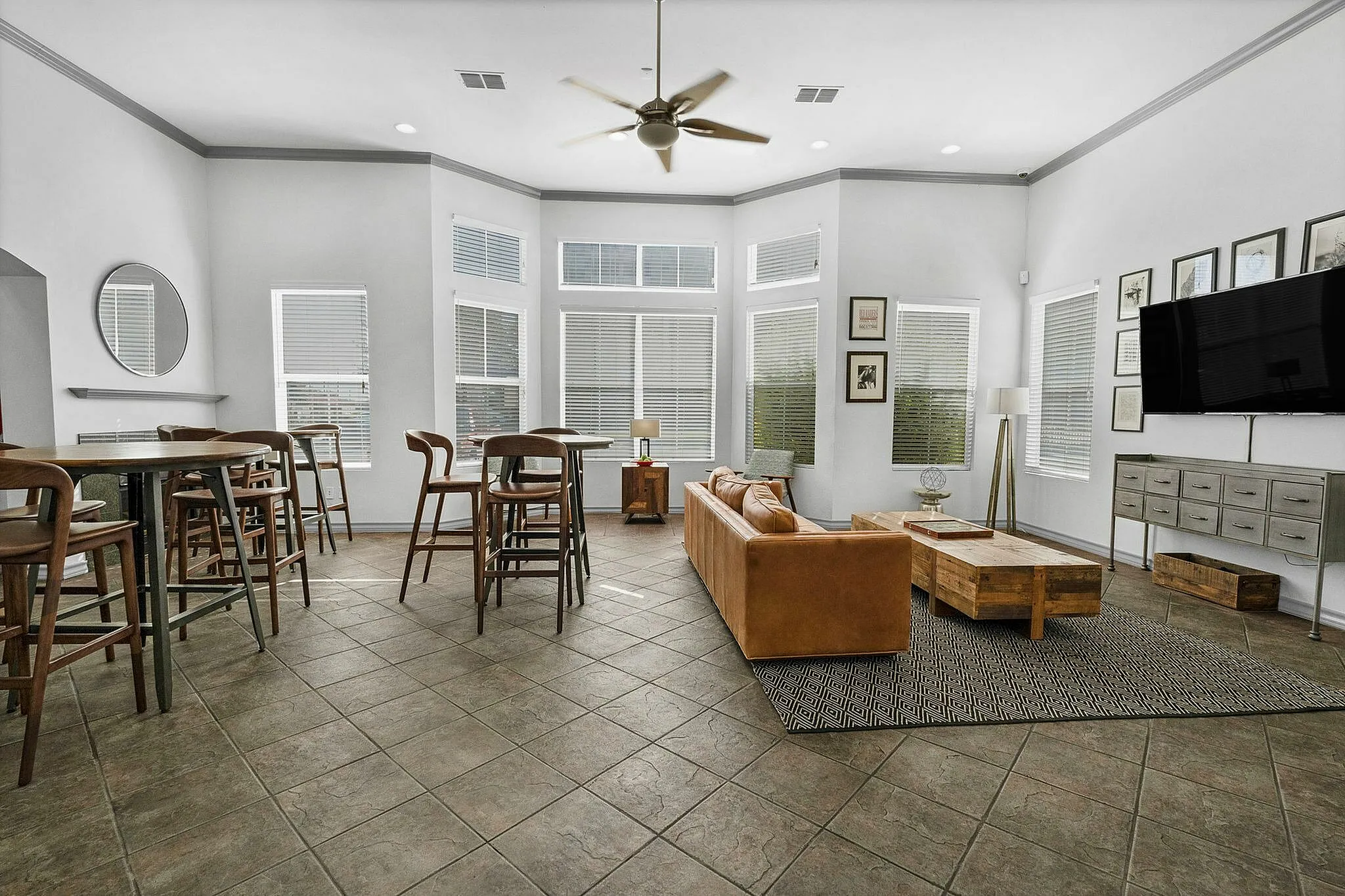 Resident clubhouse with plenty of seating and tvs