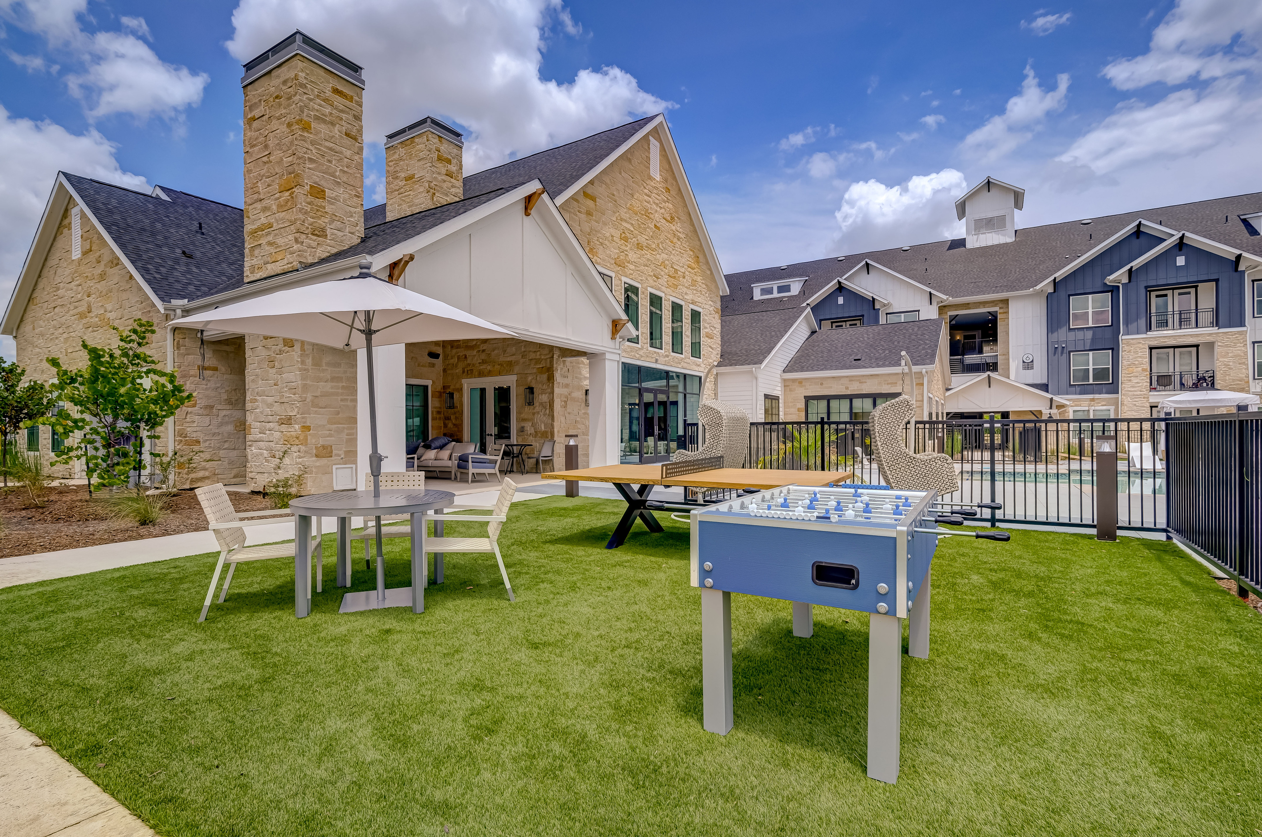 Outdoor ping pong, foosball, and seating area