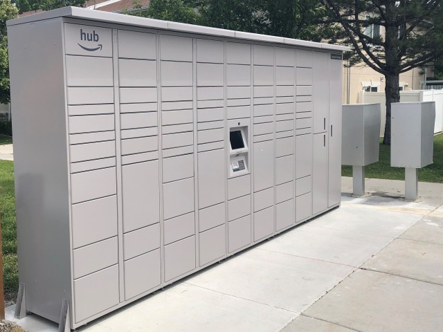 Photo of our community package lockers. Outdoor, accessible by code, open 24/7