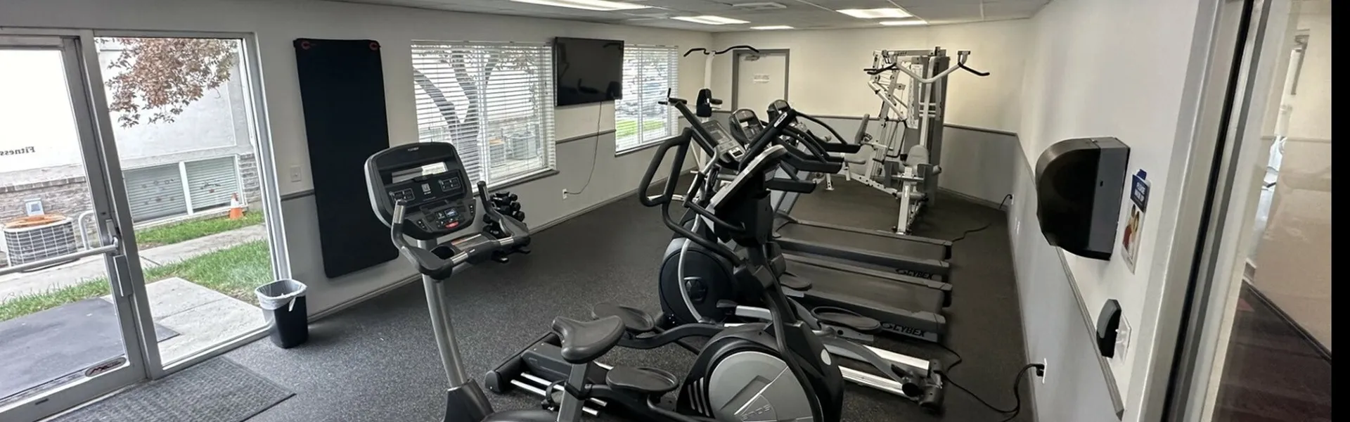 Fitness Room, Front Door, Windows, treadmills, yoga mats, TV