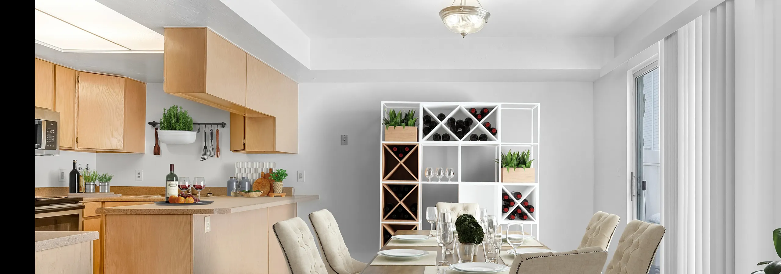 Chic dining area with a modern kitchen, featuring a wooden dining table, stylish chairs, and a wine shelf.
