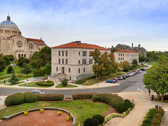 Charming campus view with iconic dome, lush greenery, and classic architecture, offering a serene and picturesque environment.