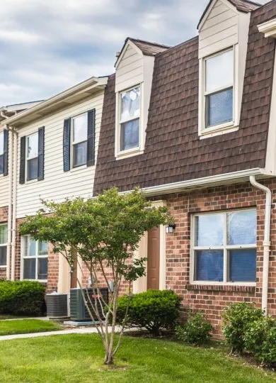 front yard of southwood townhome with tree and garden