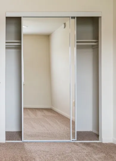 mirrored closet door in bedroom at middle branch
