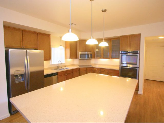 5-Bedroom Senior Officer Home on Tripler and Red Hill, kitchen with stainless appliances, corian countertop, maple cabinets