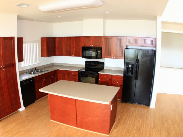 3-bedroom two story multiplex townhome on FTSH, large kitchen with black appliance package