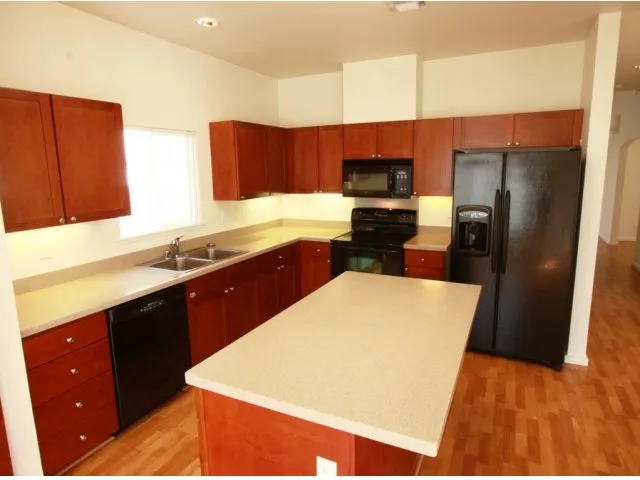 3-bedroom new single family home on FTSH, AMR, Red Hill, kitchen with ample storage and black appliances