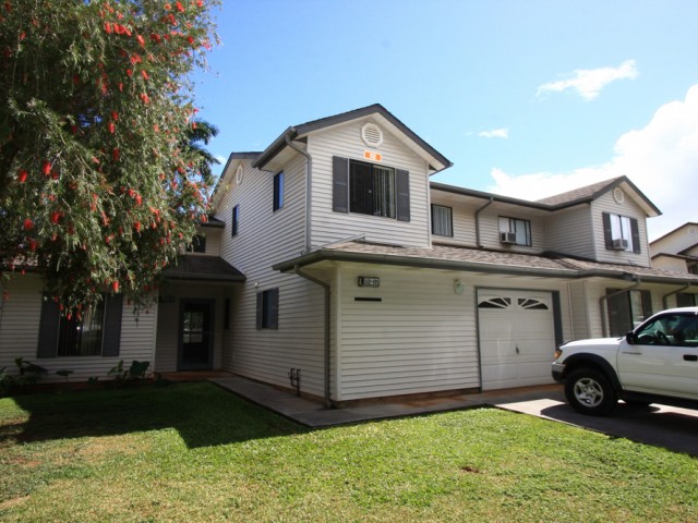 4-bedrrom two story renovated tonwhome, exterior with 1-car garage and fenced in yard