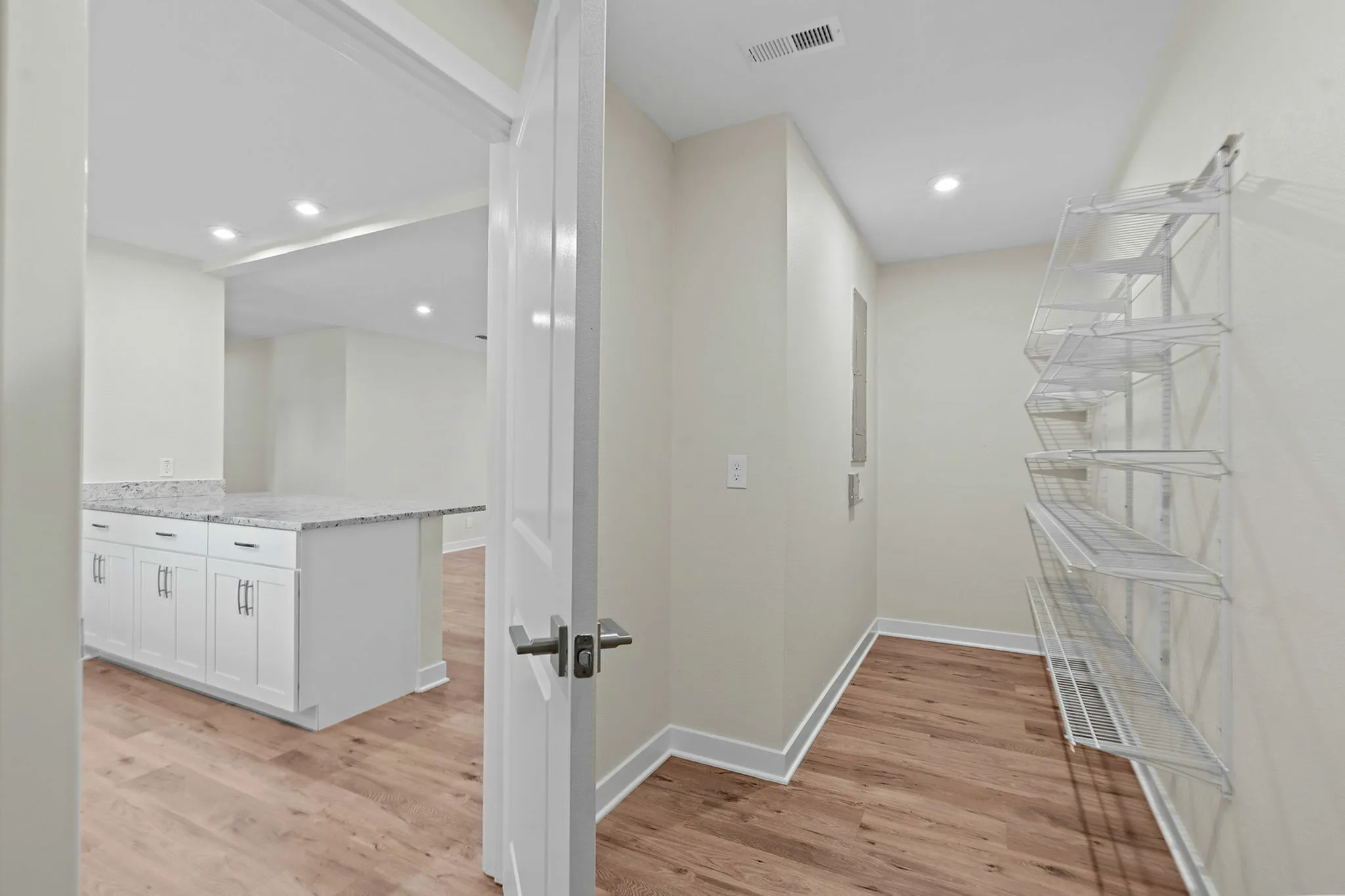 You will enjoy this large pantry that offers ample storage for your kitchen items.