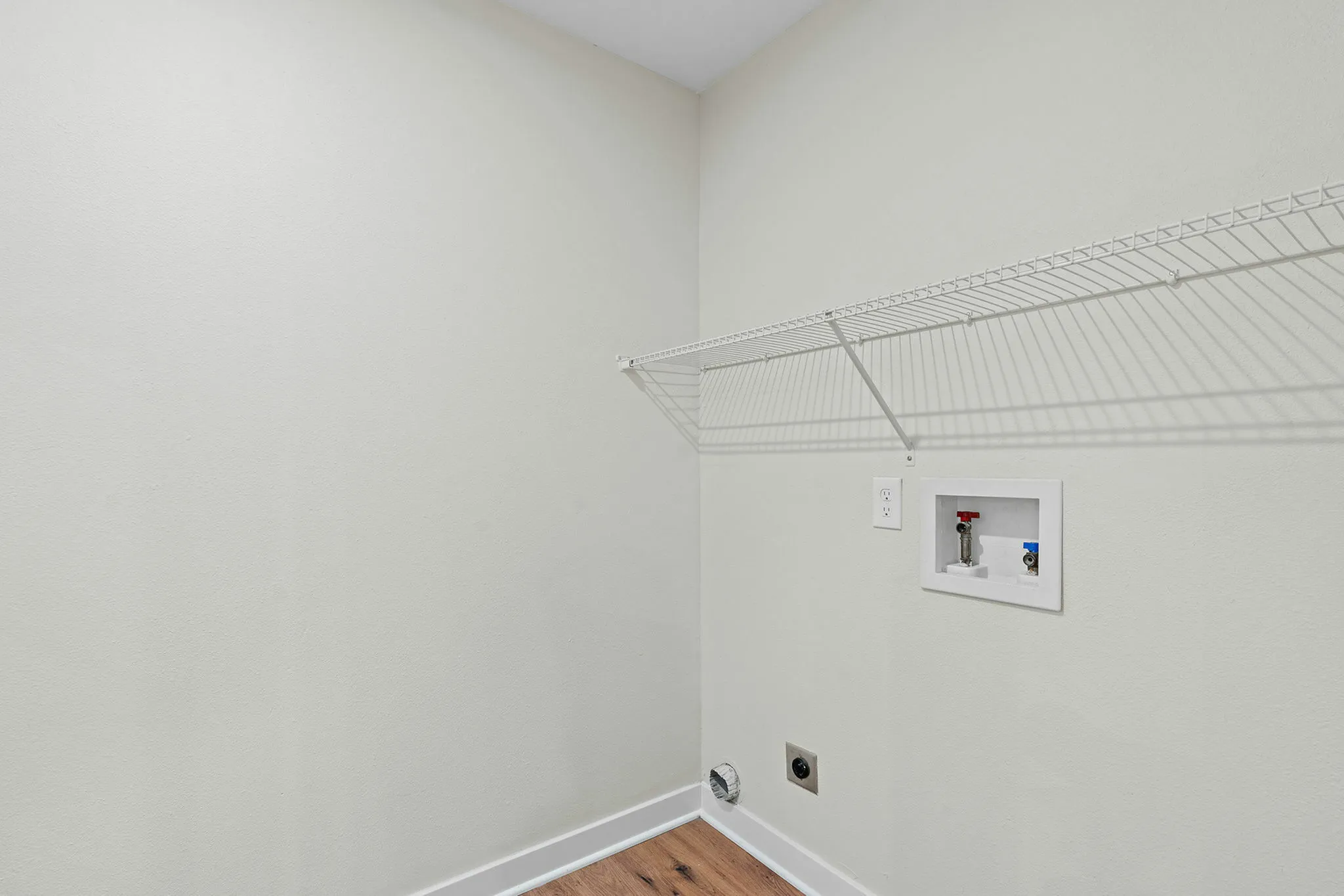 The separate laundry room offers additional storage
