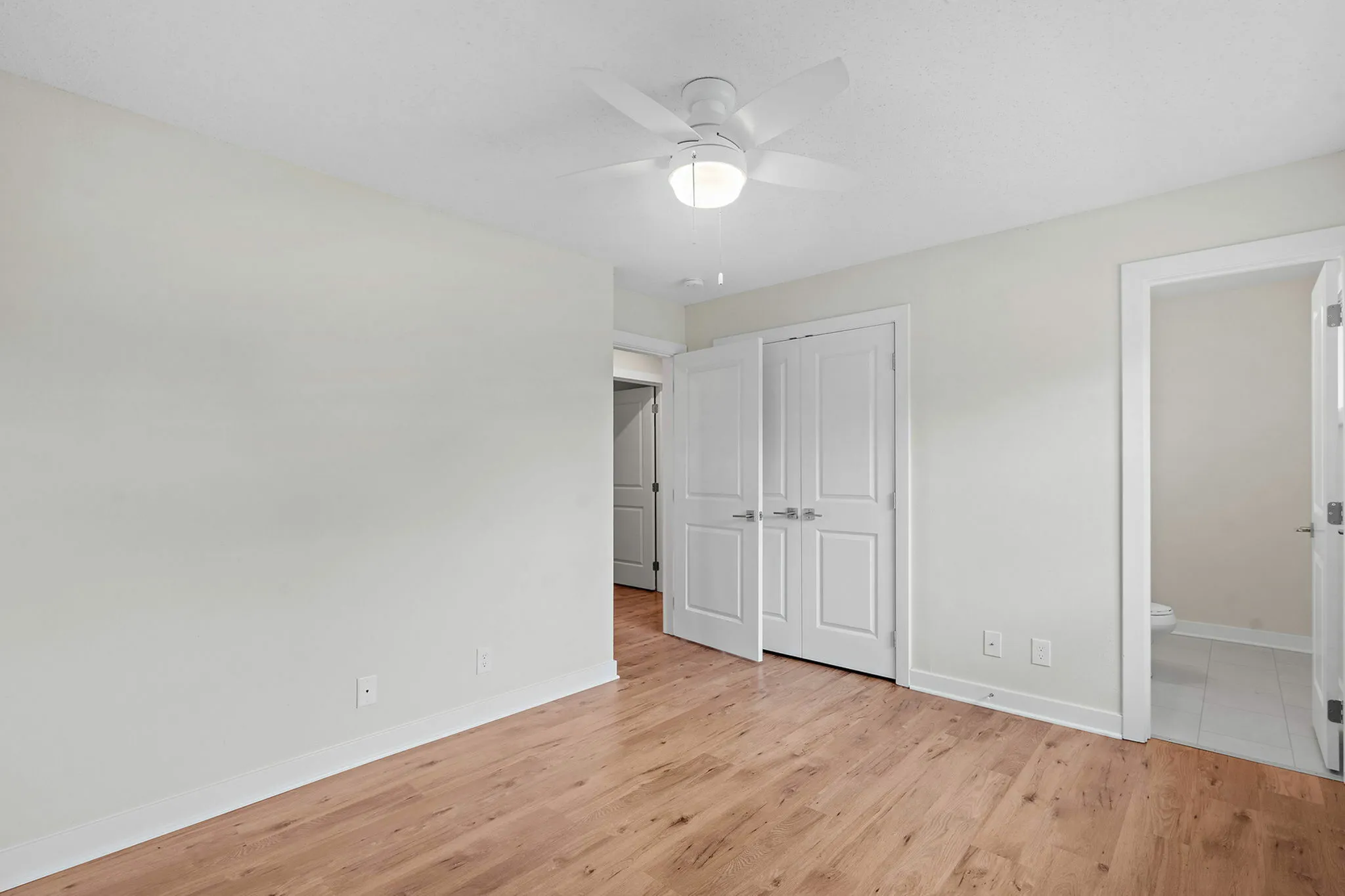 The primary bedroom offers a private bath