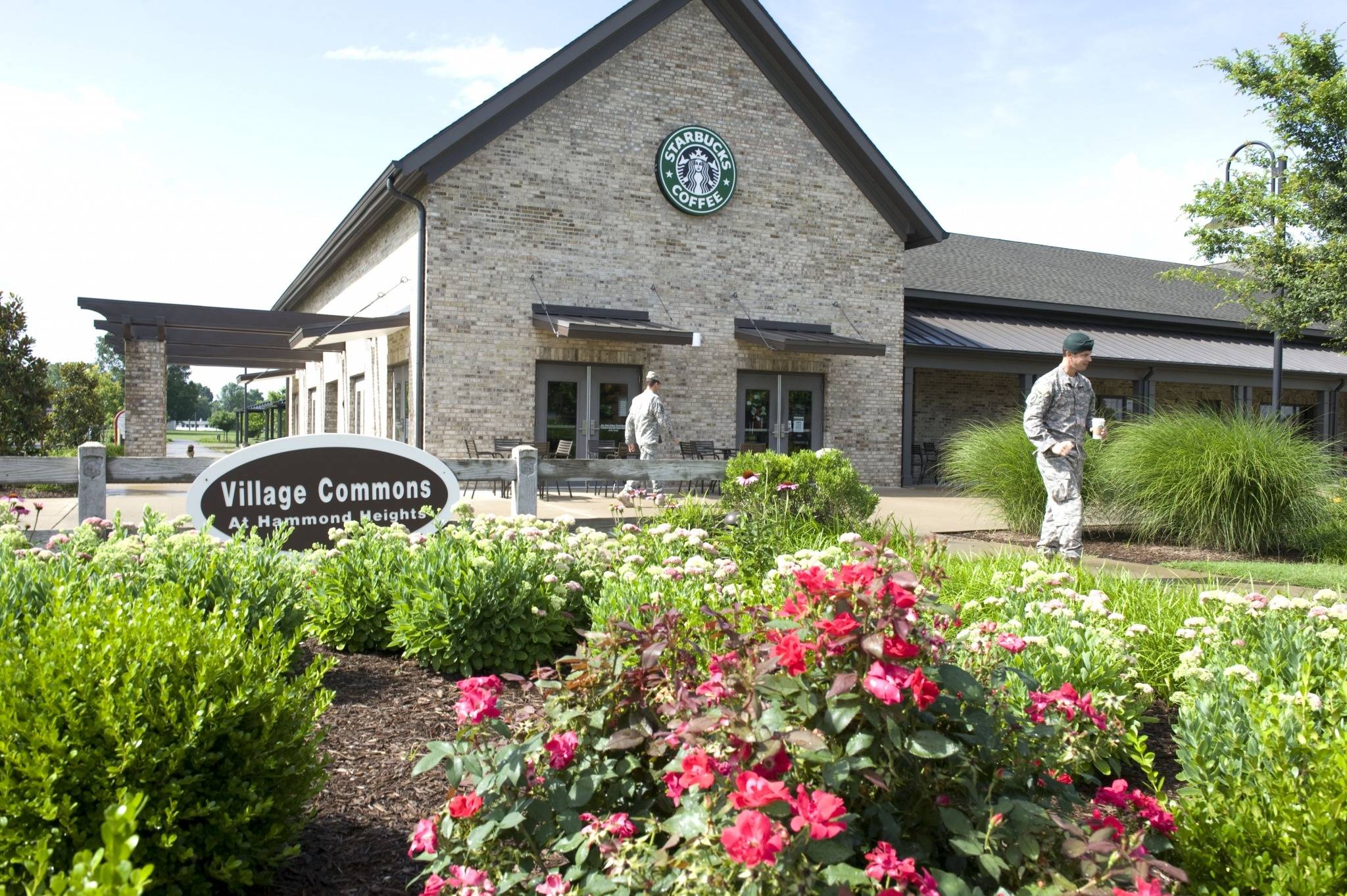 Soldiers walking outside clubhouse with Starbucks