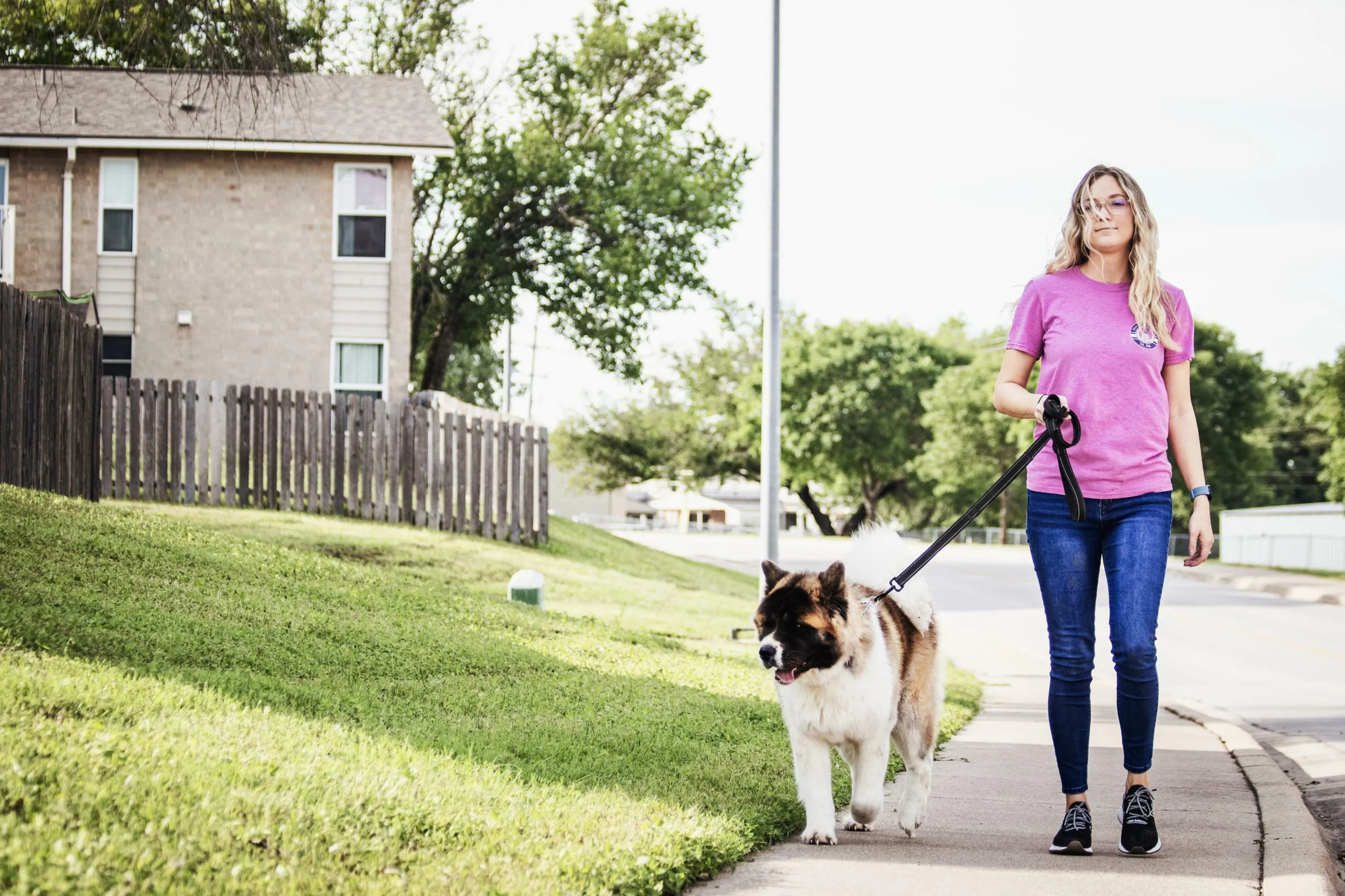 Women walking dog on Cavalry Family Housing property