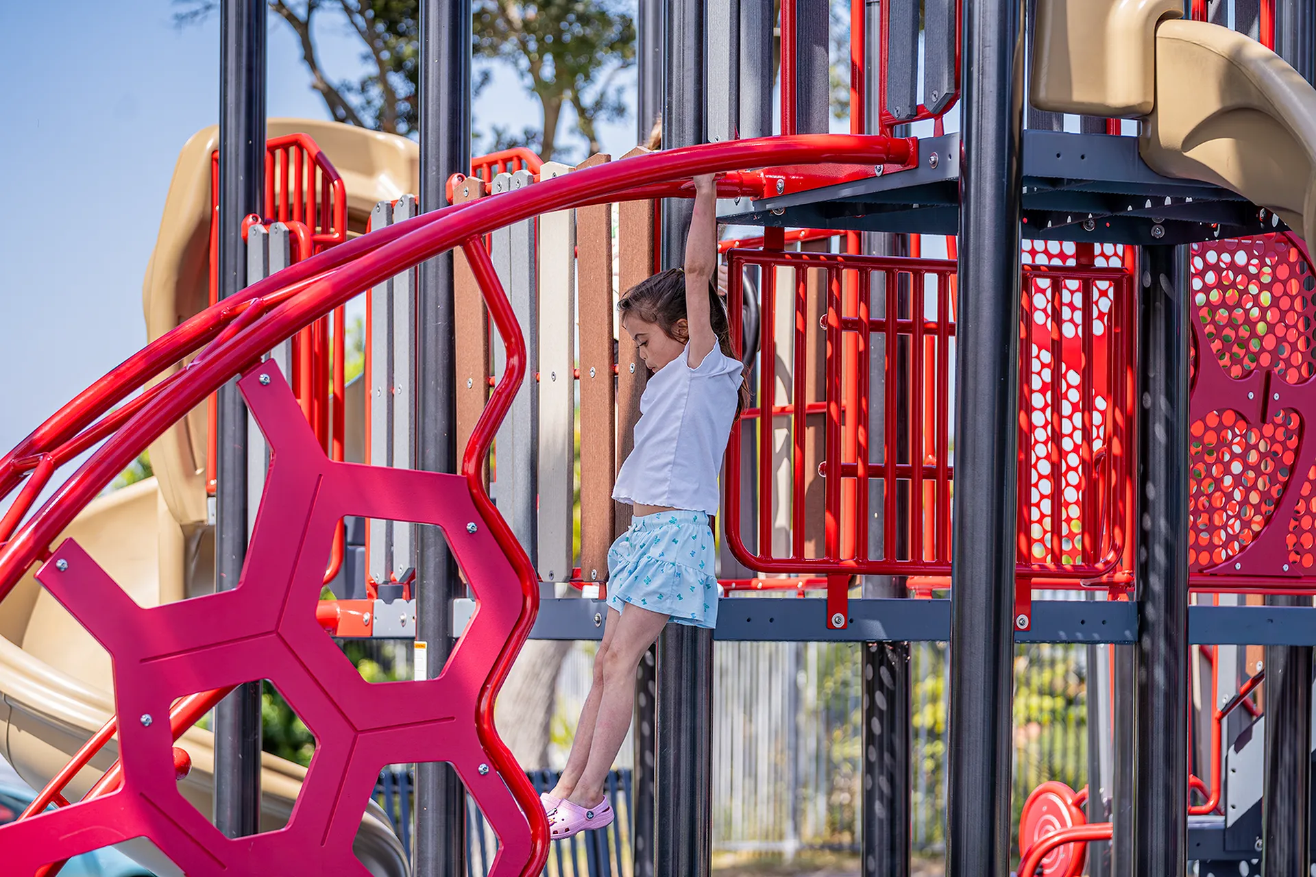 Childrens playground with blue and red equipment