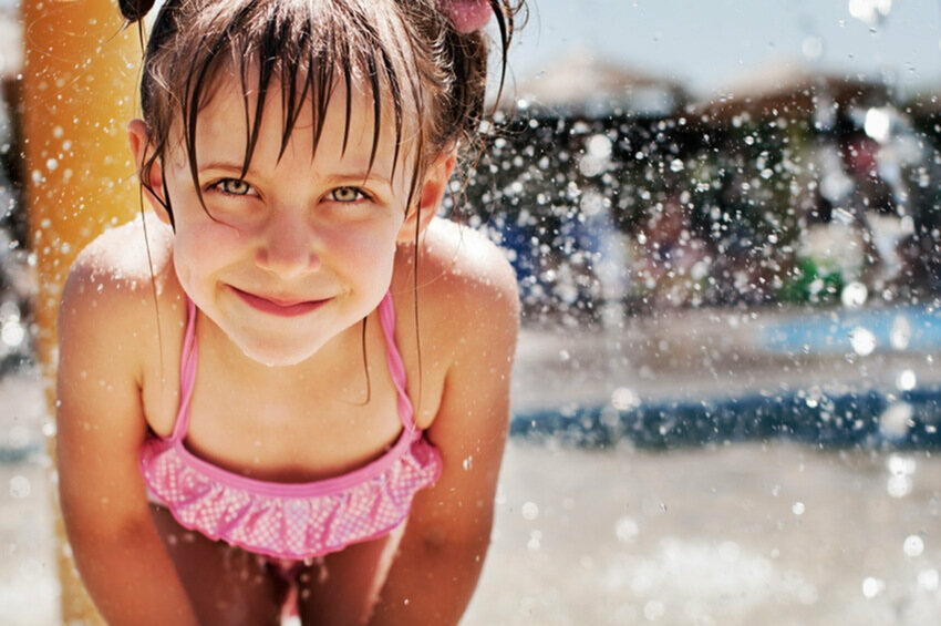 Child playing at splash park