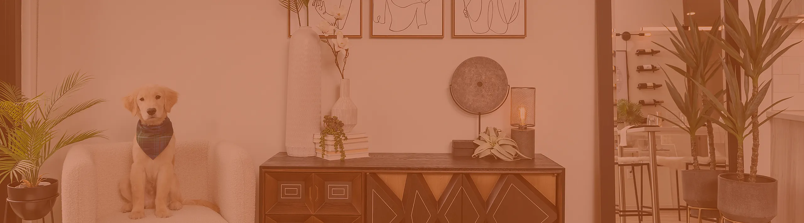 Chic modern living space featuring elegant decor, a comfy armchair with a charming puppy, and stylish wall art, creating a warm and inviting atmosphere.