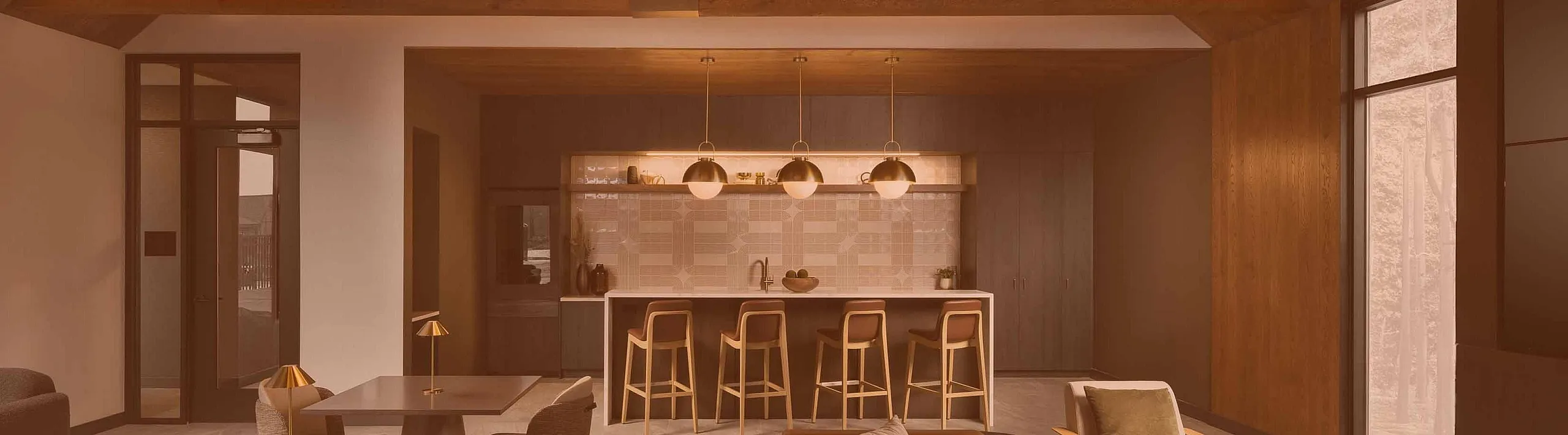 Elegant open-concept living space featuring modern kitchen with bar seating, stylish dining area, and cozy seating under a striking vaulted ceiling.