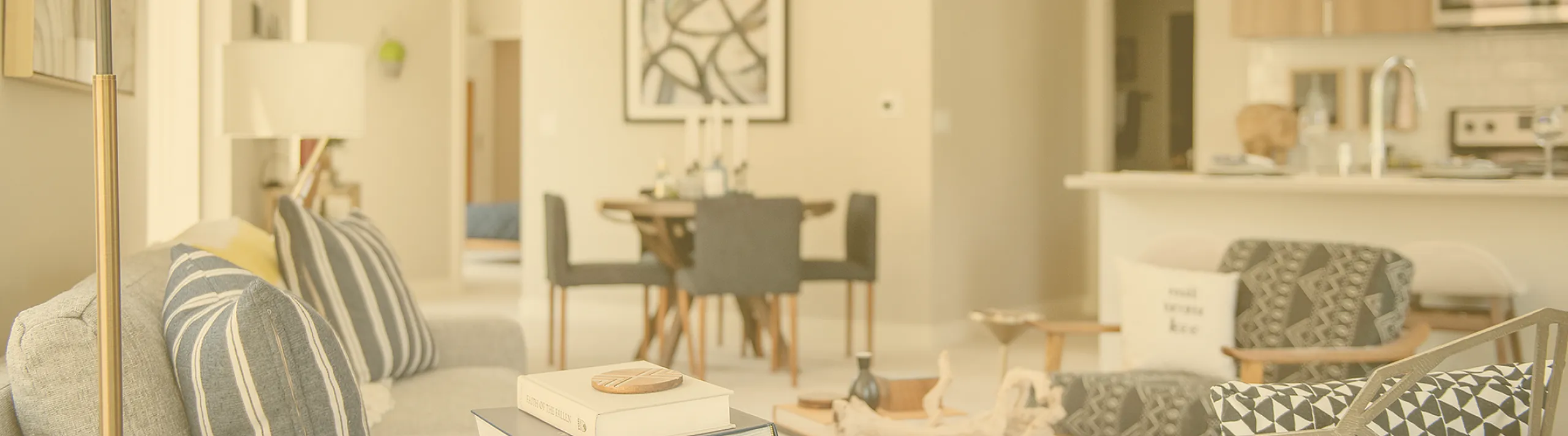 Chic open-concept living area with stylish furnishings, modern kitchen, and elegant decor creating a cozy atmosphere.