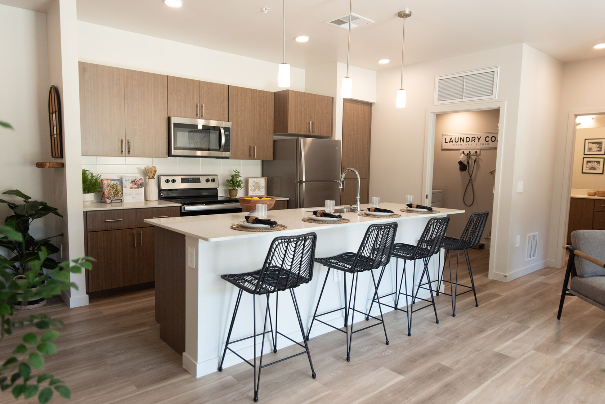 queen creek apartment with kitchen island and warm natural finishes