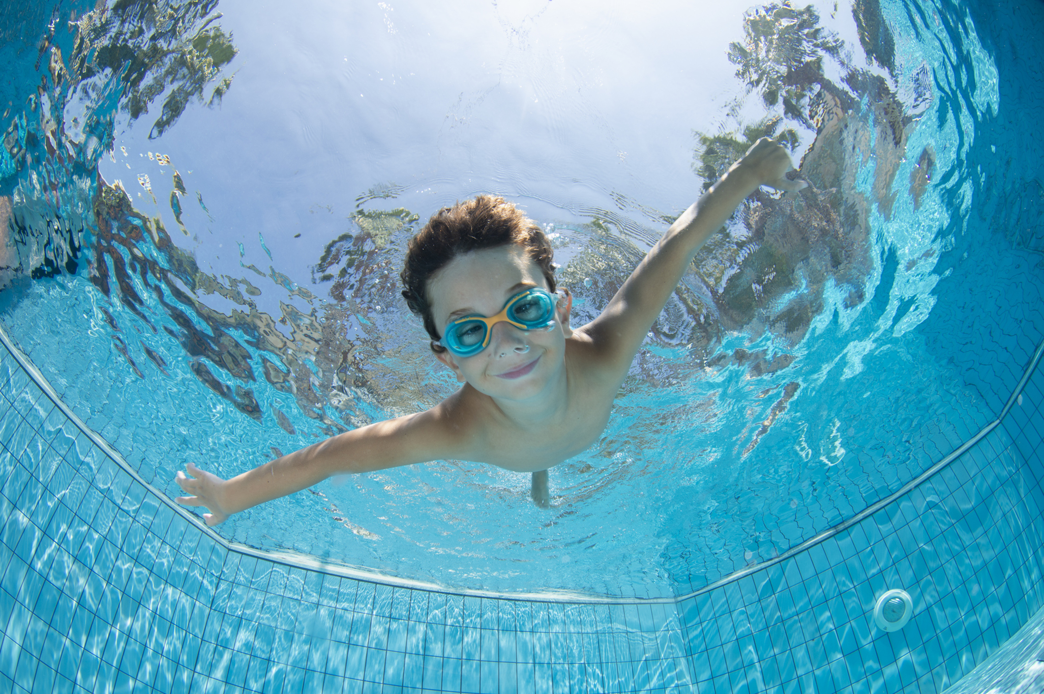 boy swimming in pool