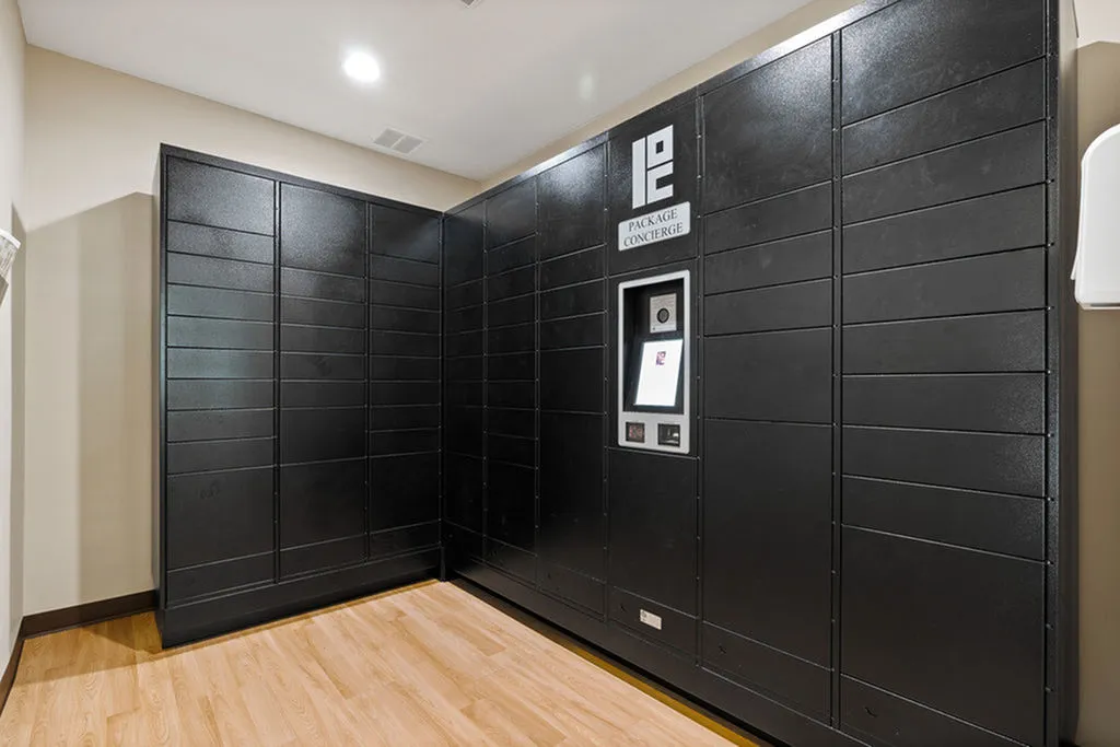 Modern package concierge system in a sleek apartment building, featuring secure lockers and advanced technology for convenient parcel pickup.