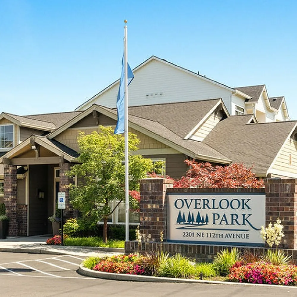 Charming Overlook Park entrance with lush landscaping and welcoming atmosphere, showcasing modern architecture and vibrant greenery.