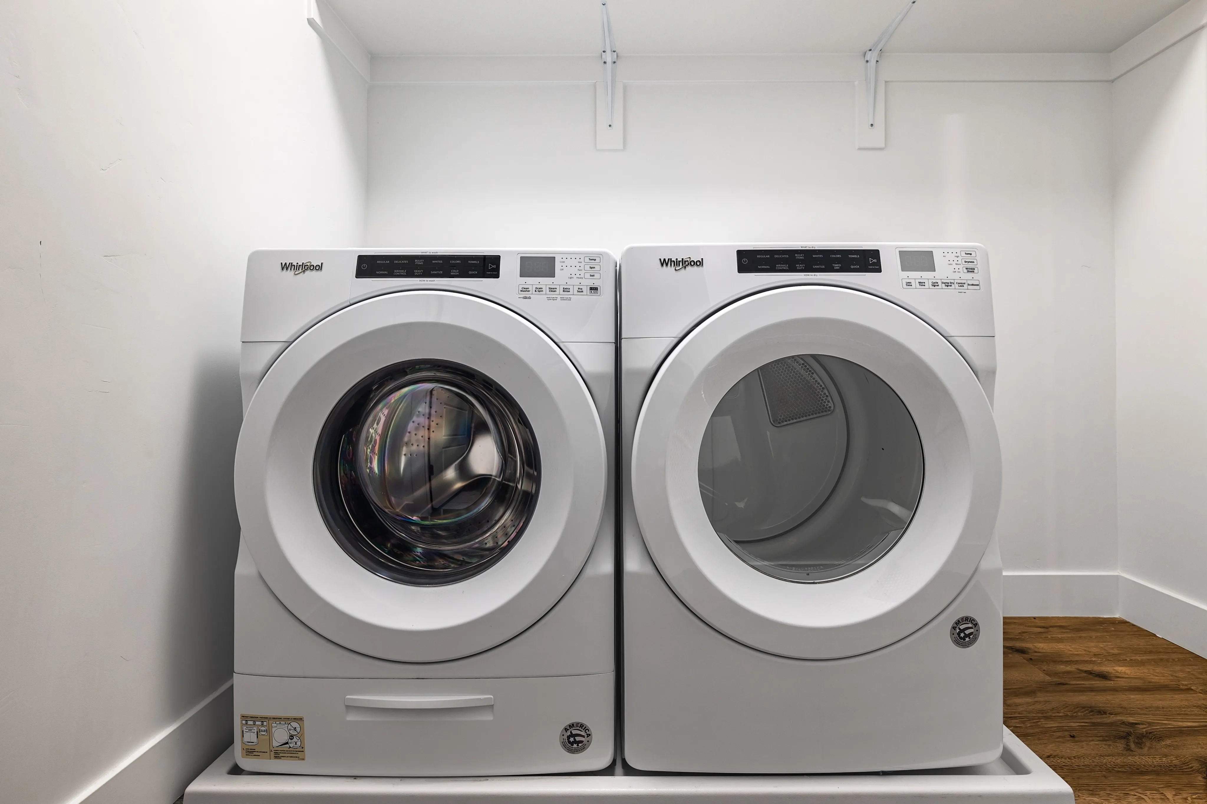 Sleek and modern laundry area featuring state-of-the-art washer and dryer with a clean, minimalist design.