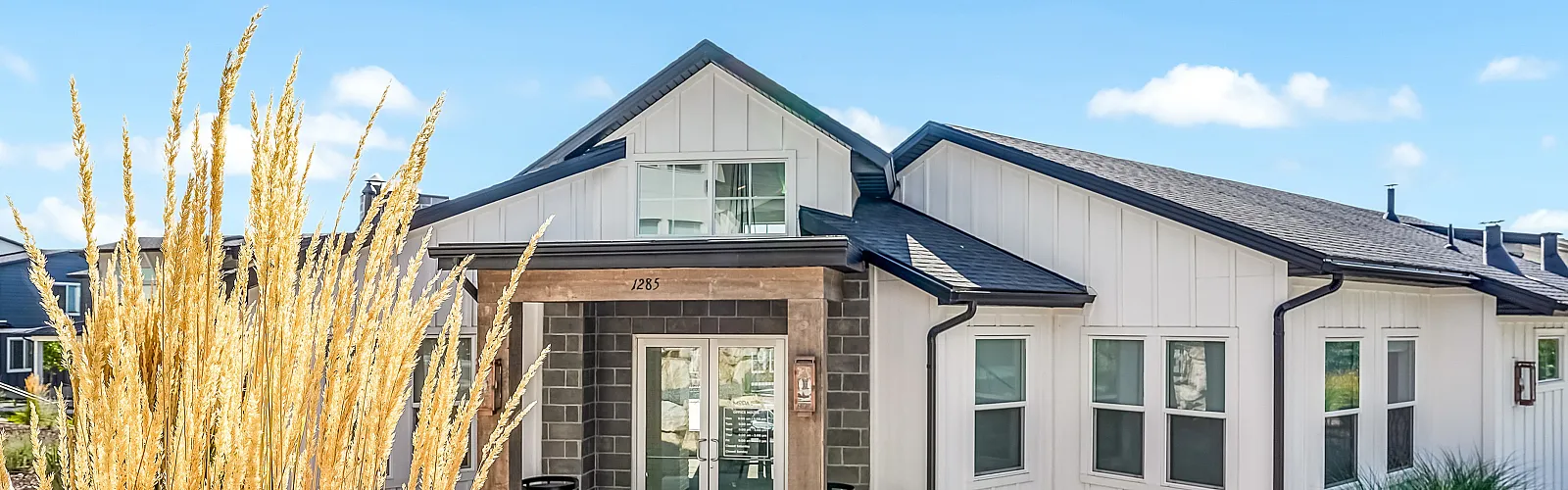 Charming single-story home with modern design, featuring a welcoming entrance and beautifully landscaped front yard.