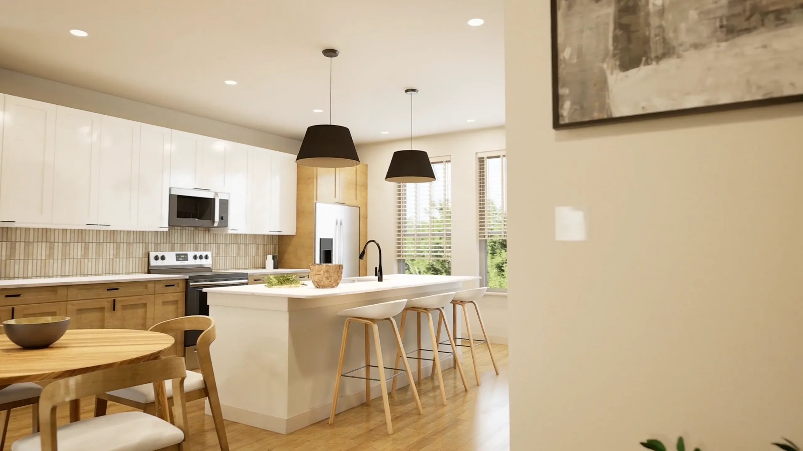 Modern kitchen with sleek white cabinets, wooden accents, elegant island with bar stools, and cozy dining area.
